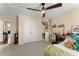 Bedroom with plush carpet, a ceiling fan, and a pair of closet doors at 4388 Cades Pointe, Marietta, GA 30066