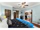 Comfortable bedroom featuring a ceiling fan, hardwood floors, and modern decor at 4388 Cades Pointe, Marietta, GA 30066