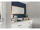 Charming coffee bar with elegant countertop and an inspirational message on a navy accent wall at 4388 Cades Pointe, Marietta, GA 30066