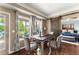 Dining room features a dining table with seating for four, a sliding barn door, and views of the backyard at 4388 Cades Pointe, Marietta, GA 30066