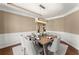 Formal dining room featuring modern lighting and a rustic dining table at 4388 Cades Pointe, Marietta, GA 30066