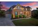 Charming two-story brick home with a well-manicured lawn, mature landscaping, and a two-car garage at 4388 Cades Pointe, Marietta, GA 30066