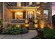 Inviting front porch with stone accents, decorative plants, and stylish lighting for a warm welcome at 4388 Cades Pointe, Marietta, GA 30066