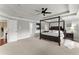 Spacious main bedroom with a four-poster bed, tray ceilings, and lots of natural light at 4388 Cades Pointe, Marietta, GA 30066