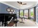 Well-lit office space with a large window, multiple monitors, and modern decor at 4388 Cades Pointe, Marietta, GA 30066