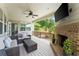 Covered outdoor living space with a fireplace and comfortable seating at 4388 Cades Pointe, Marietta, GA 30066