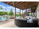 Backyard oasis featuring a pool, hot tub, lounge chairs, and an outdoor seating area under a wooden deck at 4388 Cades Pointe, Marietta, GA 30066