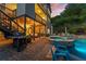 Beautiful backyard featuring the pool, hot tub, patio and staircase leading to the second story deck at 4388 Cades Pointe, Marietta, GA 30066