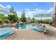 Backyard with a sparkling pool, hot tub, and lush landscaping for private relaxation at 4388 Cades Pointe, Marietta, GA 30066