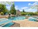 Beautiful swimming pool featuring built in waterfalls and poolside lounge chairs at 4388 Cades Pointe, Marietta, GA 30066