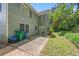 The backyard features a patio and lush green landscaping, surrounded by trees at 502 Fortune Ridge Rd, Stone Mountain, GA 30087