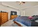 An airy main bedroom with a ceiling fan and carpet flooring at 502 Fortune Ridge Rd, Stone Mountain, GA 30087