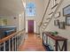 Inviting foyer with hardwood floors, staircase, and front door with a large window above at 502 Fortune Ridge Rd, Stone Mountain, GA 30087