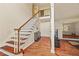 Bright foyer with hardwood floors and staircase leading to the second floor at 502 Fortune Ridge Rd, Stone Mountain, GA 30087