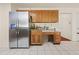 A spacious kitchen with stainless steel refrigerator and ample cabinet space at 502 Fortune Ridge Rd, Stone Mountain, GA 30087