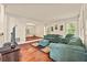 Cozy living room with hardwood floors, comfortable furniture, and natural light at 502 Fortune Ridge Rd, Stone Mountain, GA 30087