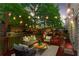 Cozy backyard deck enhanced by decorative string lights, creating a warm and inviting outdoor living space at 47 Gloster Mill Way, Lawrenceville, GA 30044