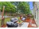 Inviting backyard deck features stylish patio furniture and ambient string lights, perfect for outdoor relaxation at 47 Gloster Mill Way, Lawrenceville, GA 30044