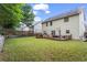 Large backyard showcases well-maintained lawn, patio, and privacy fence, creating an ideal outdoor living space at 47 Gloster Mill Way, Lawrenceville, GA 30044