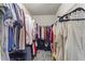 Spacious walk-in closet with ample hanging space and shelving for organized storage at 47 Gloster Mill Way, Lawrenceville, GA 30044