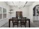 Formal dining room with coffered ceiling, large table, and elegant chandelier at 47 Gloster Mill Way, Lawrenceville, GA 30044