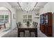 Open dining room featuring a large table set, coffered ceilings, and bright natural light at 47 Gloster Mill Way, Lawrenceville, GA 30044