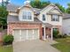 Attractive two-story home with a brick and siding exterior and attached two car garage at 47 Gloster Mill Way, Lawrenceville, GA 30044