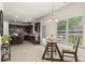 Eat in kitchen nook area featuring a glass table and pendant lighting at 47 Gloster Mill Way, Lawrenceville, GA 30044