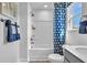 A clean bathroom with a shower-tub combo featuring stylish curtains and a modern vanity at 508 Regency Trl, Acworth, GA 30102