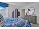 Bedroom with a gray dresser, geometric wall art, a bed, and large window allowing plenty of natural light at 508 Regency Trl, Acworth, GA 30102