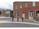 Historic red brick building exterior with original doors, with brick and paved sidewalk at 508 Regency Trl, Acworth, GA 30102