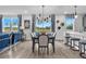 A well-lit dining area with a view to the backyard featuring modern decor and seating for six at 508 Regency Trl, Acworth, GA 30102
