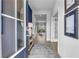 A welcoming entryway with a view to the dining area featuring modern decor and a gray rug at 508 Regency Trl, Acworth, GA 30102