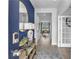 A welcoming entryway with a blue door, view to the dining area, and modern decor at 508 Regency Trl, Acworth, GA 30102