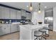 Well-lit kitchen featuring a large island with a breakfast bar, and stainless steel appliances at 508 Regency Trl, Acworth, GA 30102