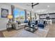 A bright living room featuring a sofa, armchairs, a coffee table, and a dining area at 508 Regency Trl, Acworth, GA 30102