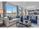 A bright and airy living room featuring large windows and a view to the dining area and kitchen at 508 Regency Trl, Acworth, GA 30102