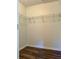 Walk-in closet with wire shelving and laminate floors, offering ample storage space and simple organization at 5458 Stagecoach Rd, Ellenwood, GA 30294