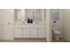 Modern bathroom with a double vanity, sleek fixtures, and minimalist décor at 616 Blue Sky Blvd, Acworth, GA 30102