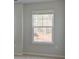 Neutral-toned bedroom features a large window and ample natural light, creating a bright and inviting space at 76 Homesite Dulles Dr, Mcdonough, GA 30253