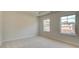 Carpeted bedroom featuring two windows at 76 Homesite Dulles Dr, Mcdonough, GA 30253
