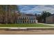 Beautiful two-story home featuring a landscaped front yard and a classic architectural style at 76 Homesite Dulles Dr, Mcdonough, GA 30253