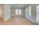 Bright living room features great natural light and access to both a bathroom and an outdoor patio at 76 Homesite Dulles Dr, Mcdonough, GA 30253