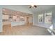 Open-concept living area with stylish kitchen, large windows, and light-filled spaces for comfortable living at 76 Homesite Dulles Dr, Mcdonough, GA 30253