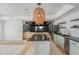 Entertainer's basement bar with modern fixtures and adjacent media room for hosting at 1100 Lady Slipper Way, Canton, GA 30115