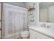 Bright bathroom with stylish shower curtain, white vanity, framed mirror and modern faucet at 1100 Lady Slipper Way, Canton, GA 30115