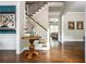 Elegant foyer with hardwood floors, staircase, and decorative accents at 1100 Lady Slipper Way, Canton, GA 30115