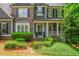 Beautiful two-story home with a well-maintained front yard and classic architectural details at 1100 Lady Slipper Way, Canton, GA 30115