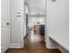 Hallway view into a dining area showcases the home's open layout, bright light, and hardwood floors at 1100 Lady Slipper Way, Canton, GA 30115