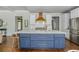 Gourmet kitchen featuring a large island with marble countertop and stainless steel appliances at 1100 Lady Slipper Way, Canton, GA 30115